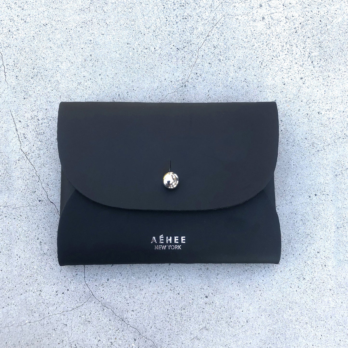 Chic black cardholder wallet crafted from Italian vegetable tanned leather for a minimal yet sophisticated look.