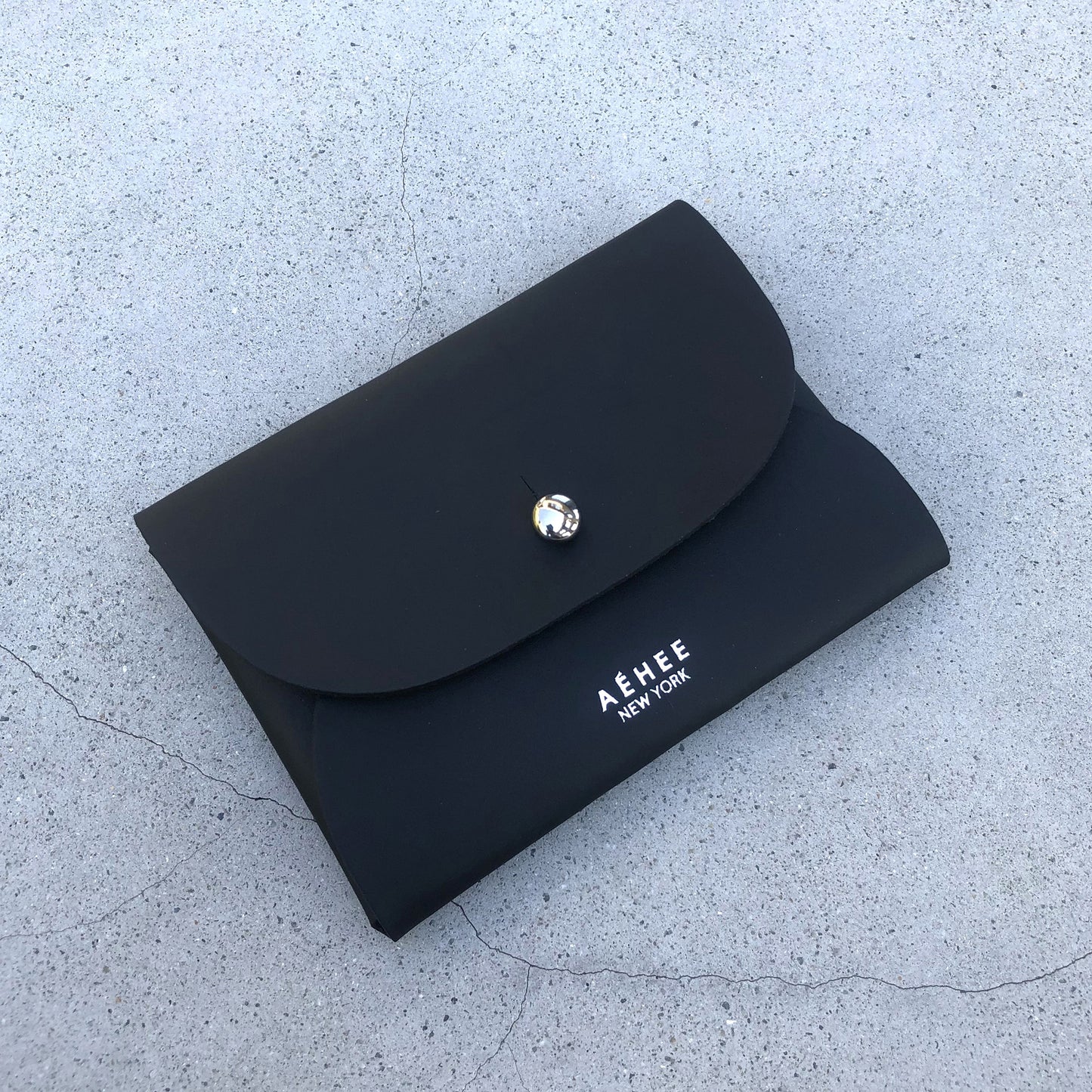 Chic black cardholder wallet crafted from Italian vegetable tanned leather for a minimal yet sophisticated look.