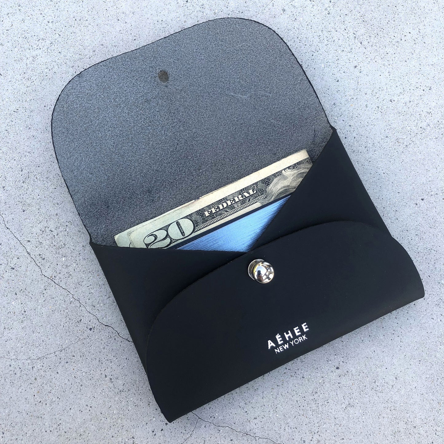 Chic black cardholder wallet crafted from Italian vegetable tanned leather for a minimal yet sophisticated look.