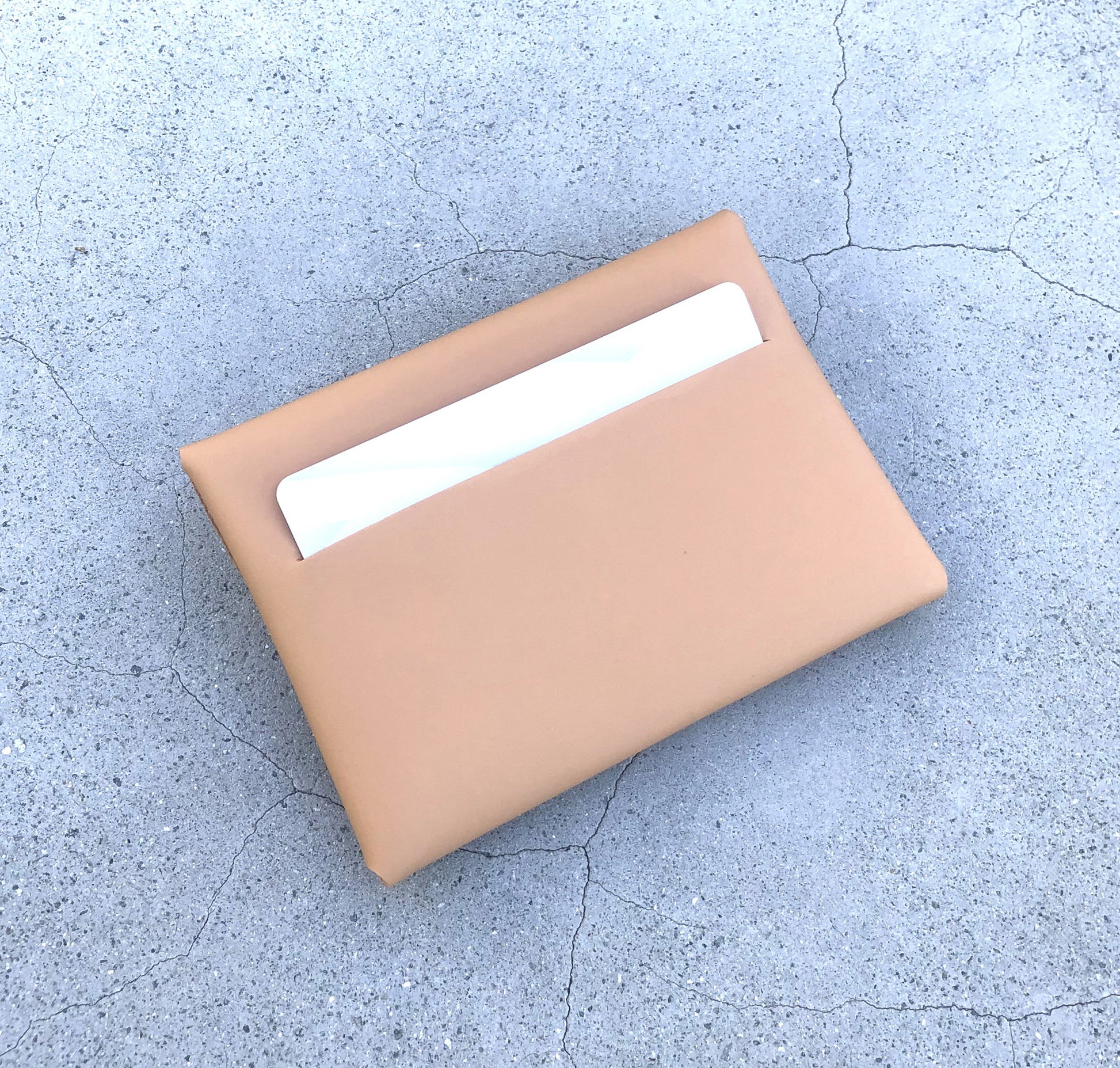 Chic beige cardholder wallet crafted from Italian vegetable tanned leather for a minimal yet sophisticated look.