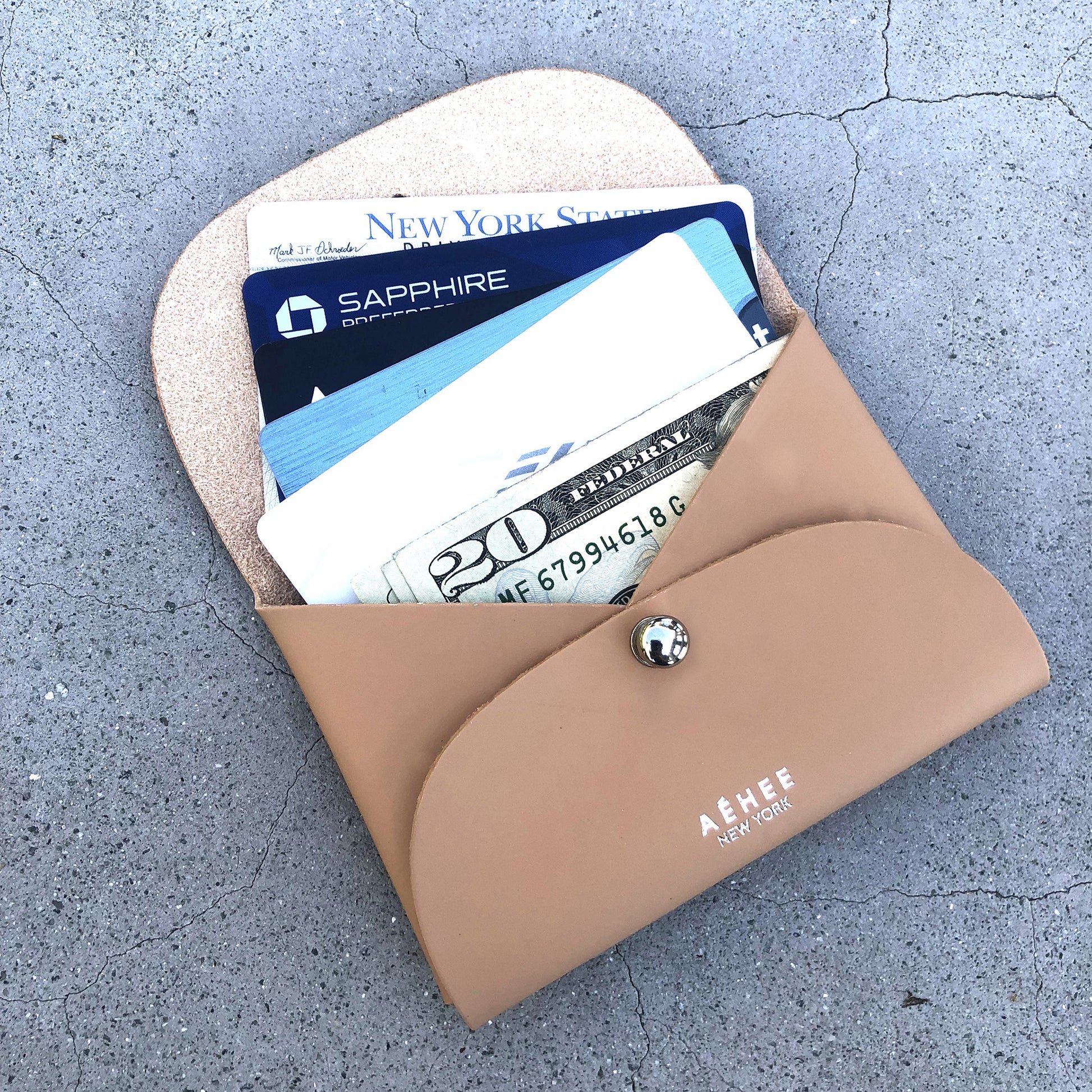 Chic beige cardholder wallet crafted from Italian vegetable tanned leather for a minimal yet sophisticated look.