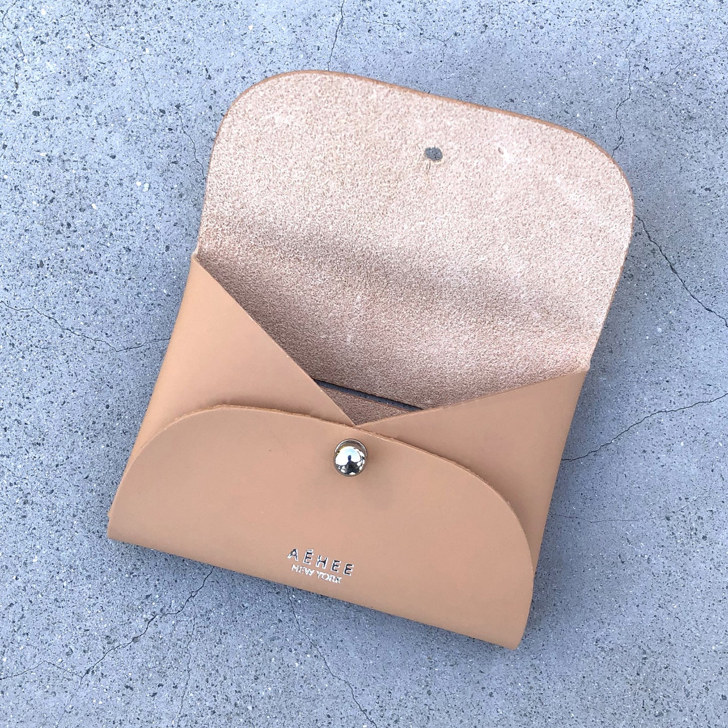 Chic beige cardholder wallet crafted from Italian vegetable tanned leather for a minimal yet sophisticated look.