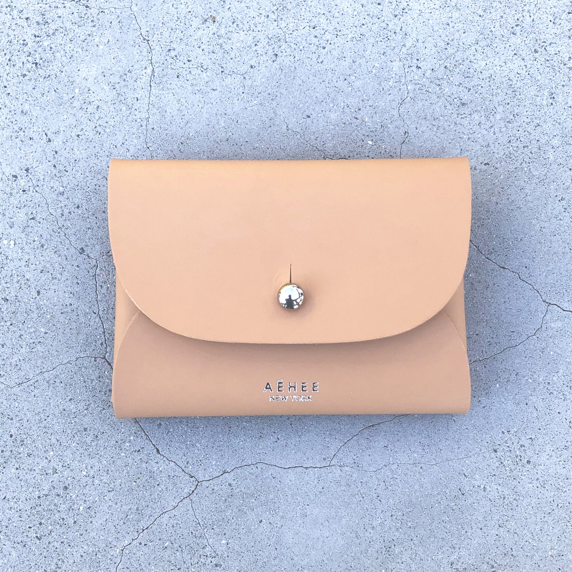 Chic beige cardholder wallet crafted from Italian vegetable tanned leather for a minimal yet sophisticated look.