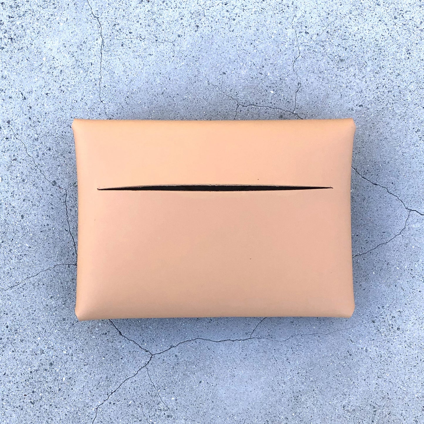 Chic beige cardholder wallet crafted from Italian vegetable tanned leather for a minimal yet sophisticated look.