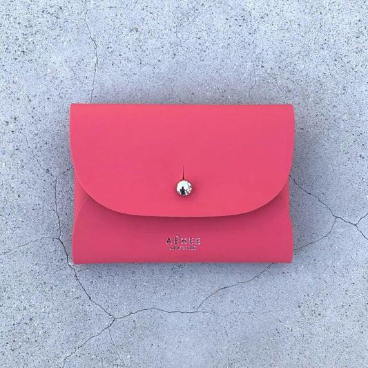 Chic red cardholder wallet crafted from Italian vegetable tanned leather for a minimal yet sophisticated look.