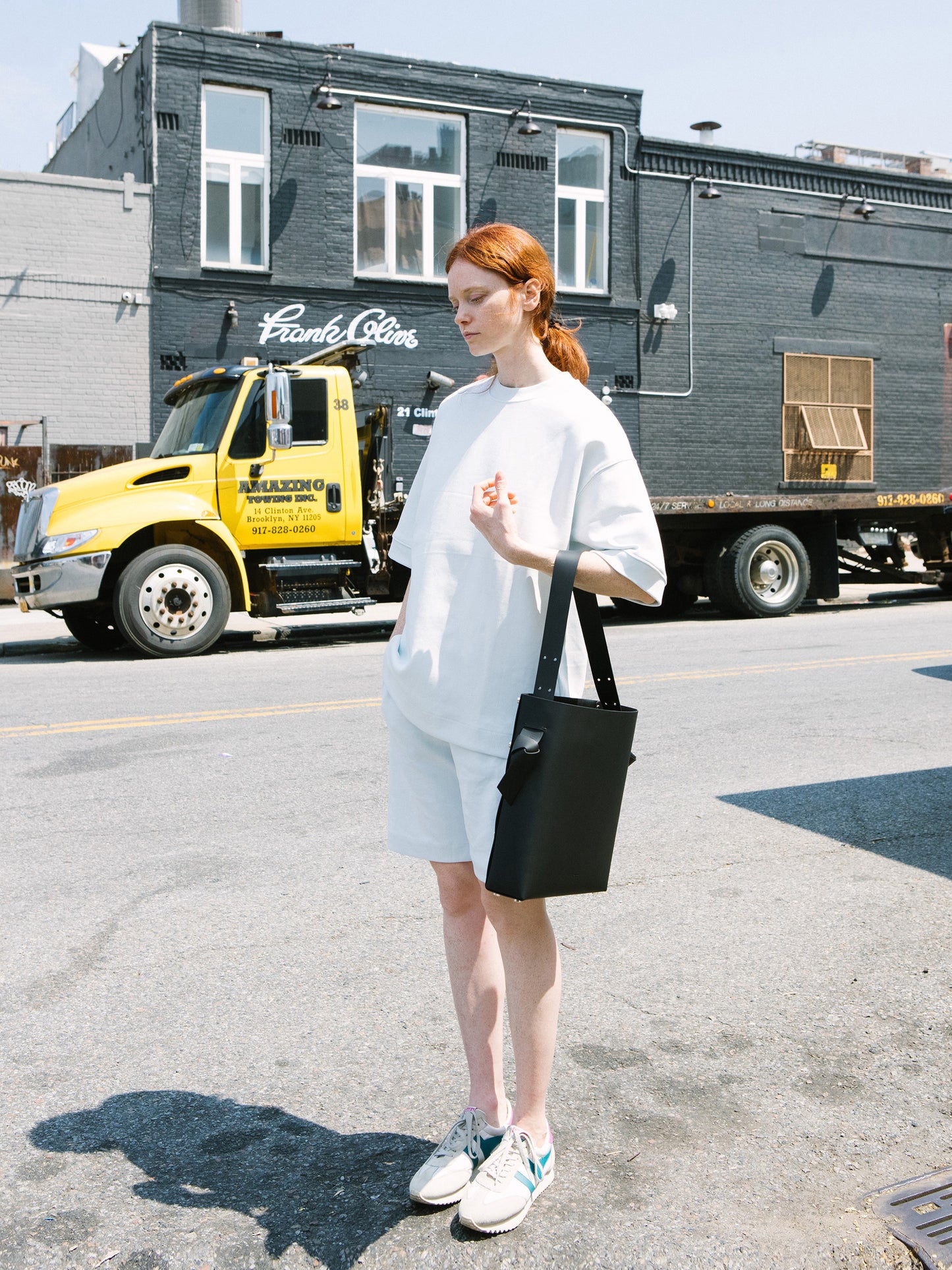 Chic black tote and bucket bag crafted from Italian vegetable tanned leather for a minimal yet sophisticated look.