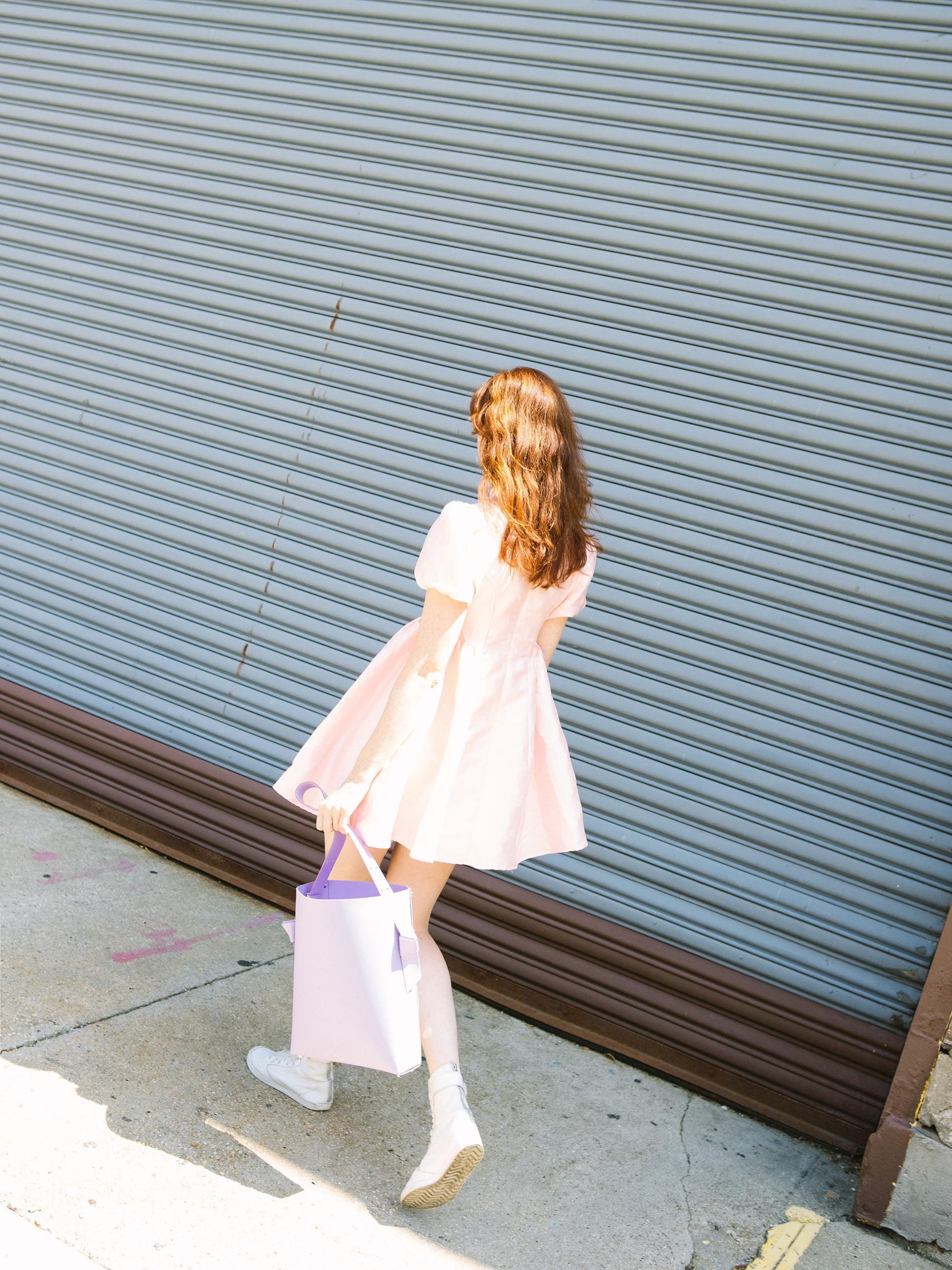 Chic lavender tote and bucket bag crafted from Italian vegetable tanned leather for a minimal yet sophisticated look.