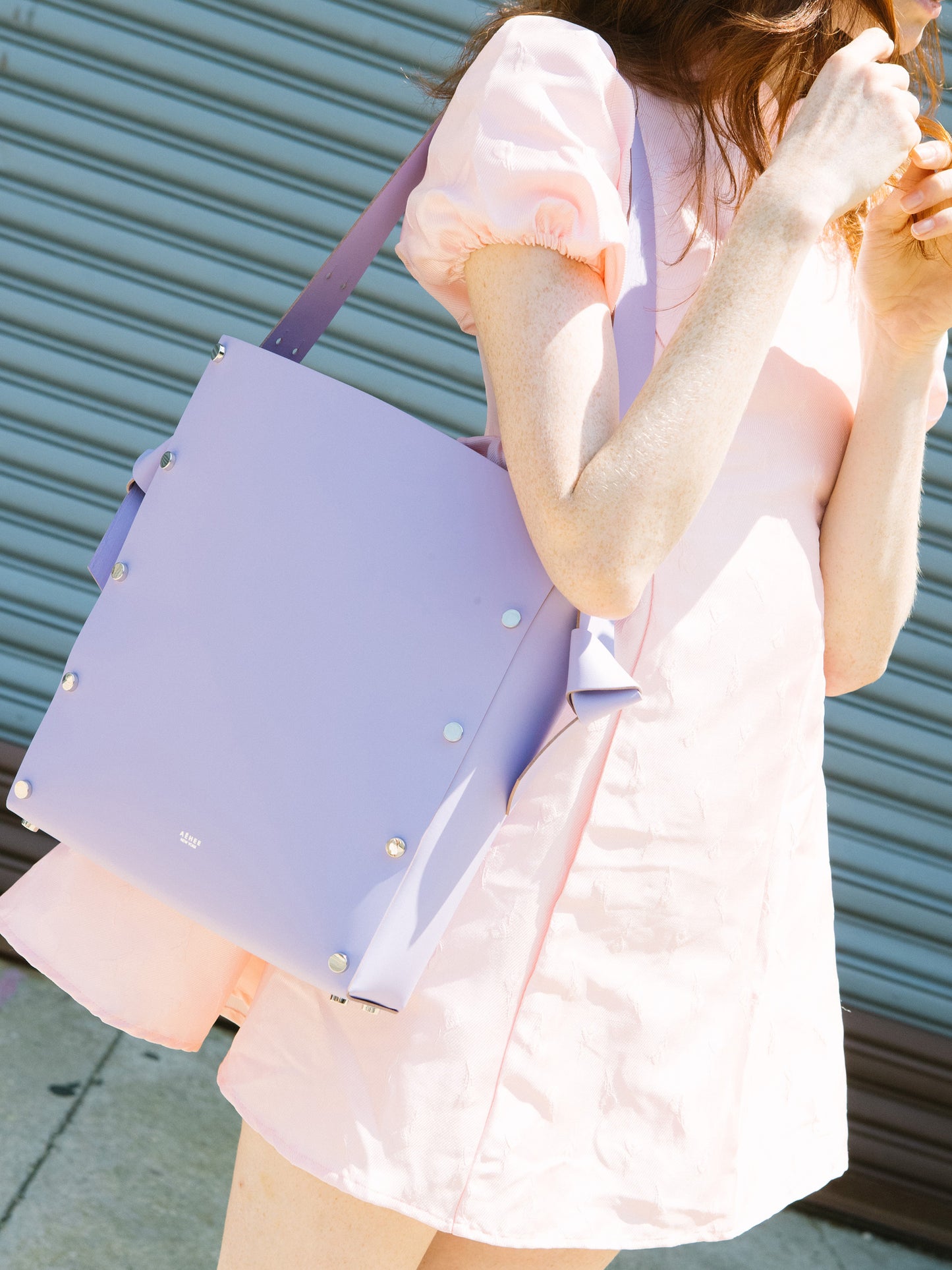 Chic lavender tote and bucket bag crafted from Italian vegetable tanned leather for a minimal yet sophisticated look.