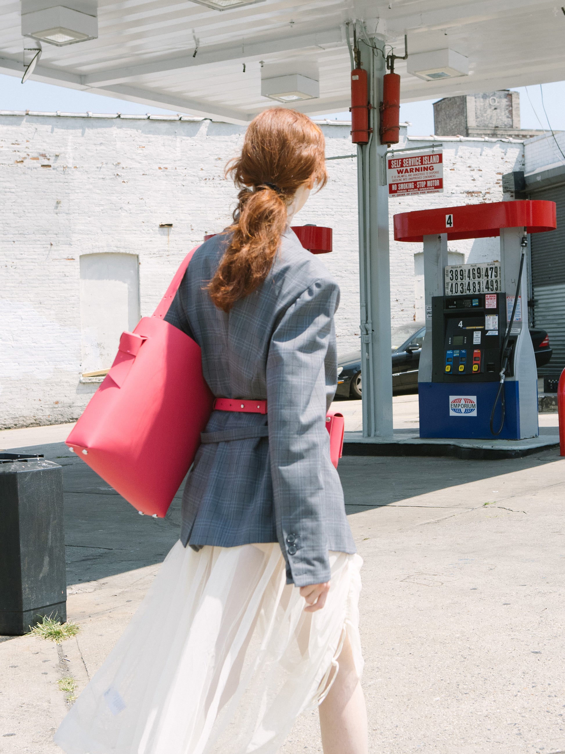 Chic red tote and bucket bag crafted from Italian vegetable tanned leather for a minimal yet sophisticated look.