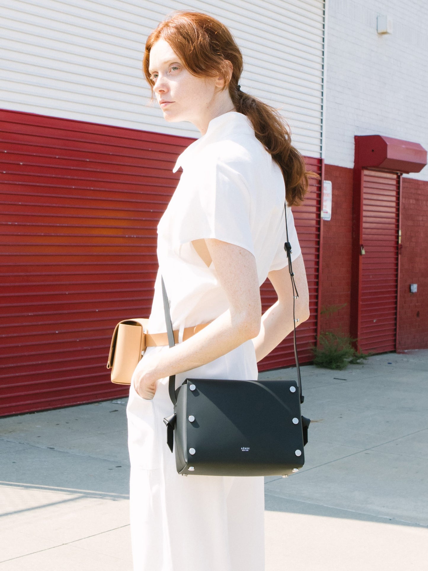 Chic black crossbody bag and shoulder bag with adjustable strap crafted from Italian vegetable tanned leather for a minimal yet sophisticated look.