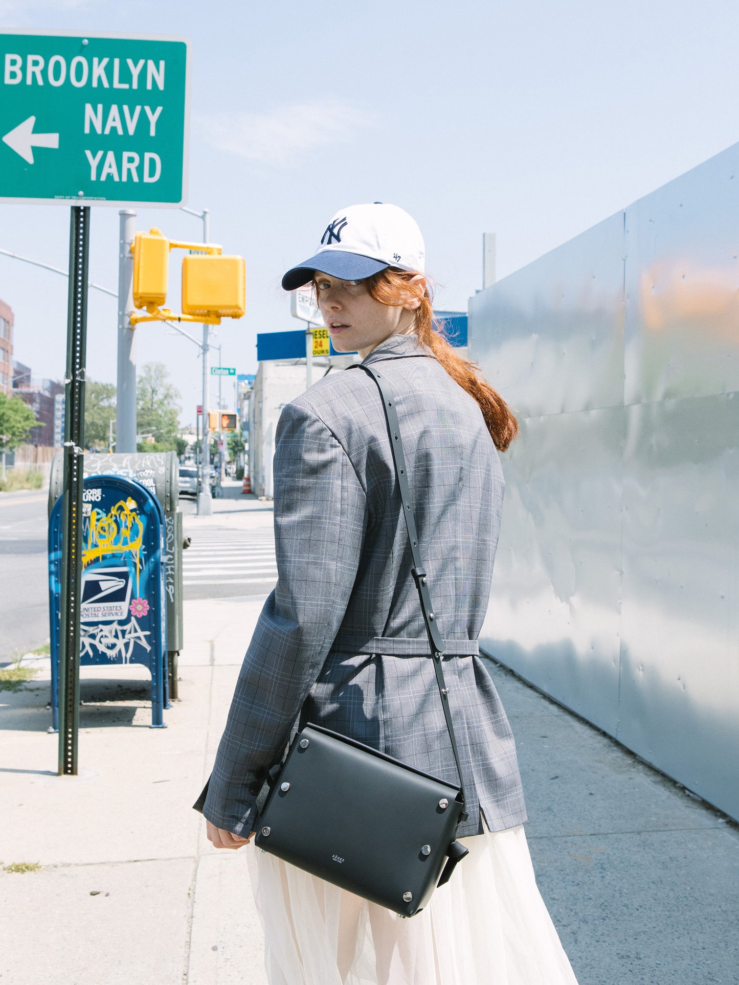 Chic black crossbody bag and shoulder bag with adjustable strap crafted from Italian vegetable tanned leather for a minimal yet sophisticated look.