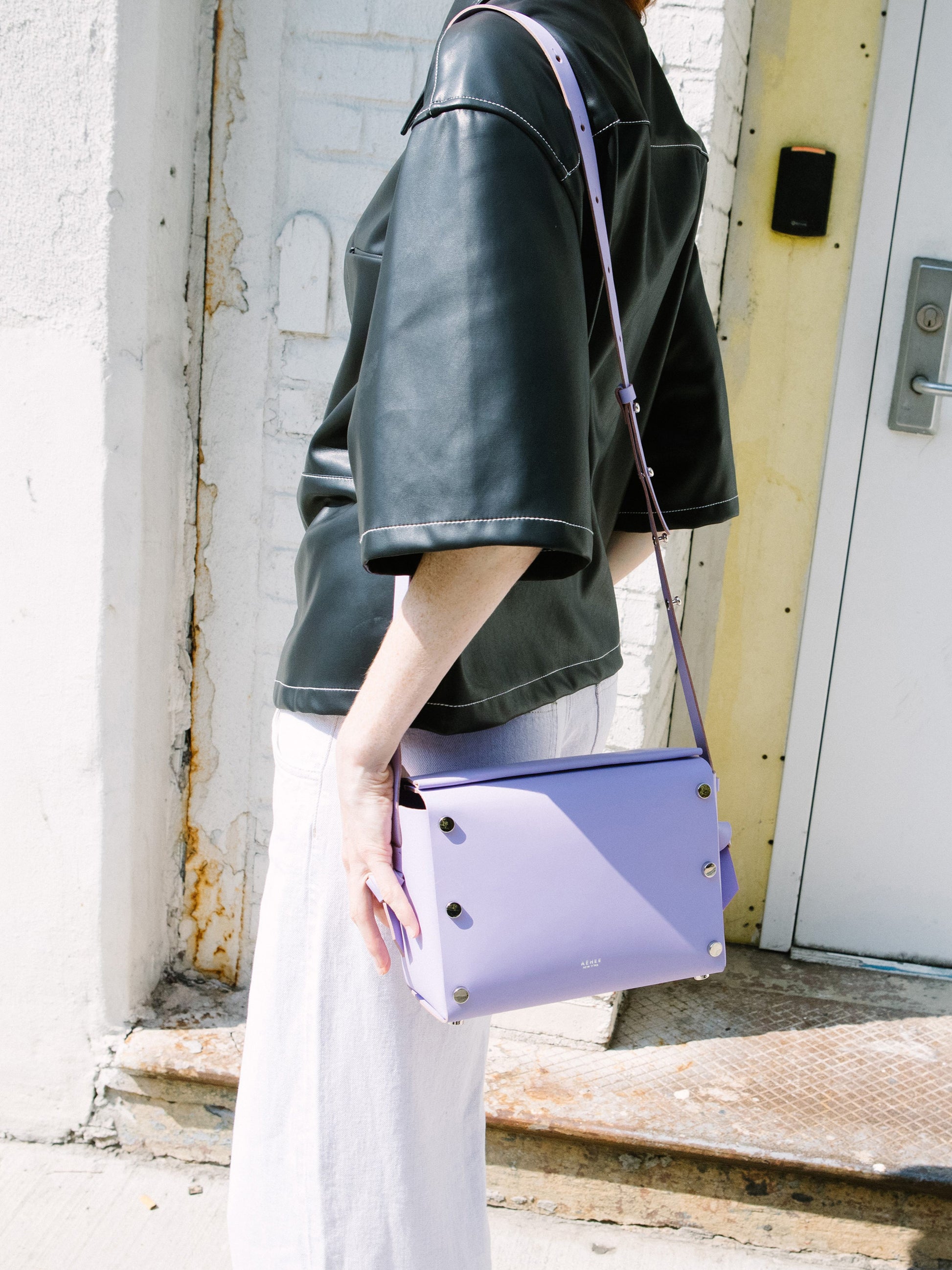 Chic lavender crossbody bag and shoulder bag with adjustable strap crafted from Italian vegetable tanned leather for a minimal yet sophisticated look.