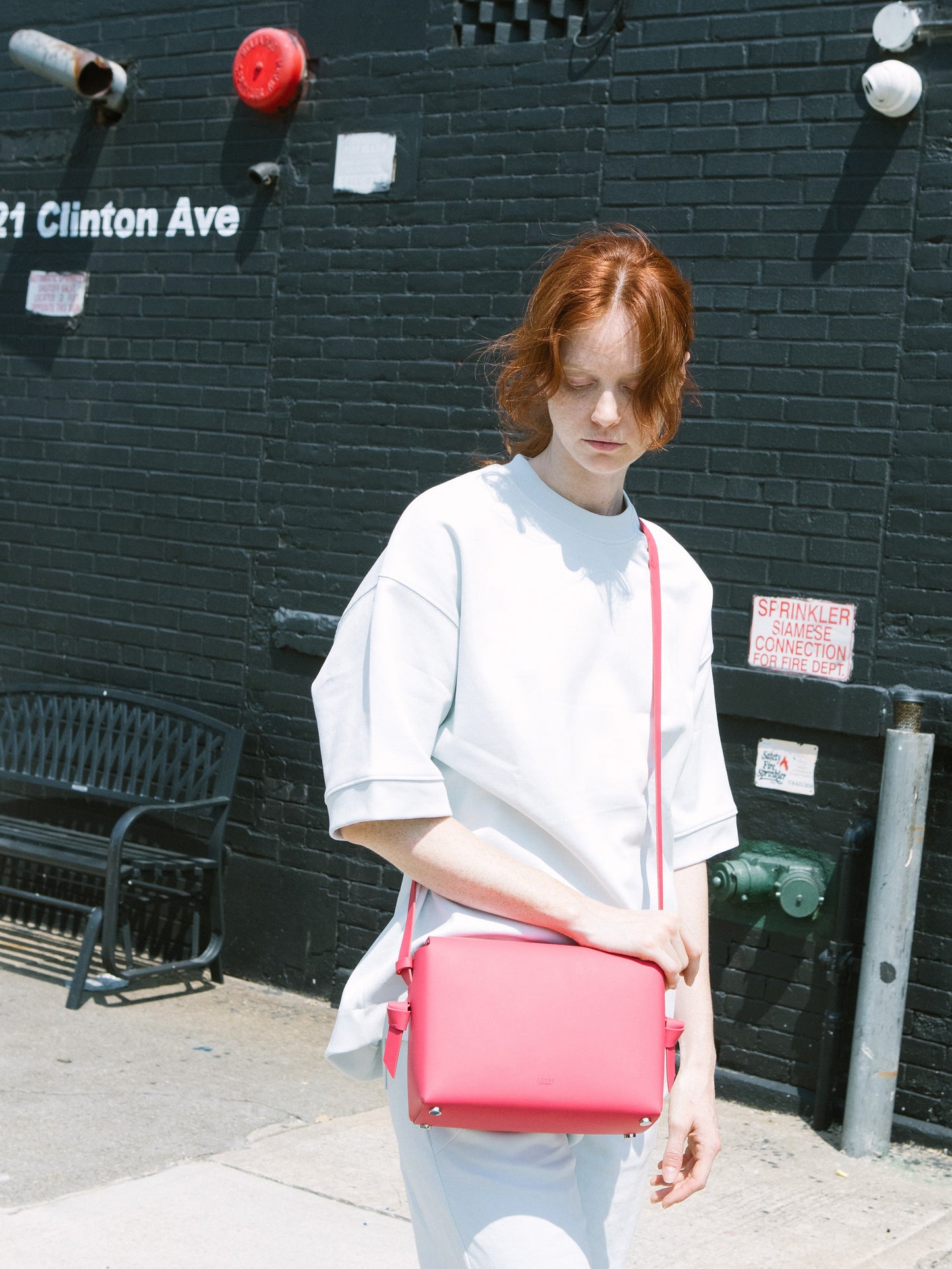 Chic red crossbody bag and shoulder bag with adjustable strap crafted from Italian vegetable tanned leather for a minimal yet sophisticated look.