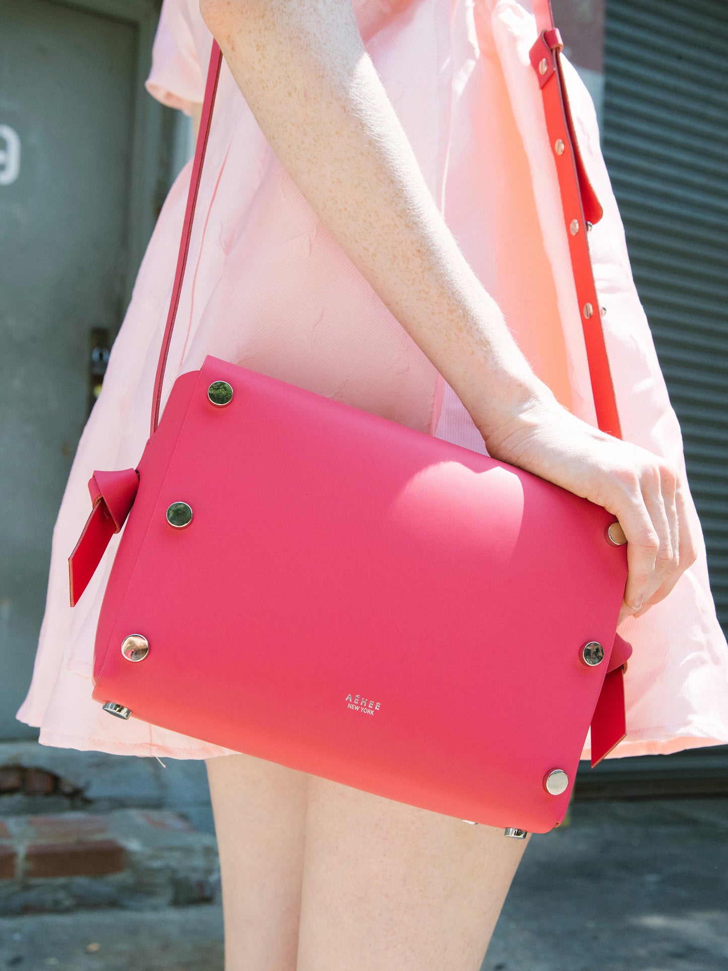 Chic red crossbody bag and shoulder bag with adjustable strap crafted from Italian vegetable tanned leather for a minimal yet sophisticated look.