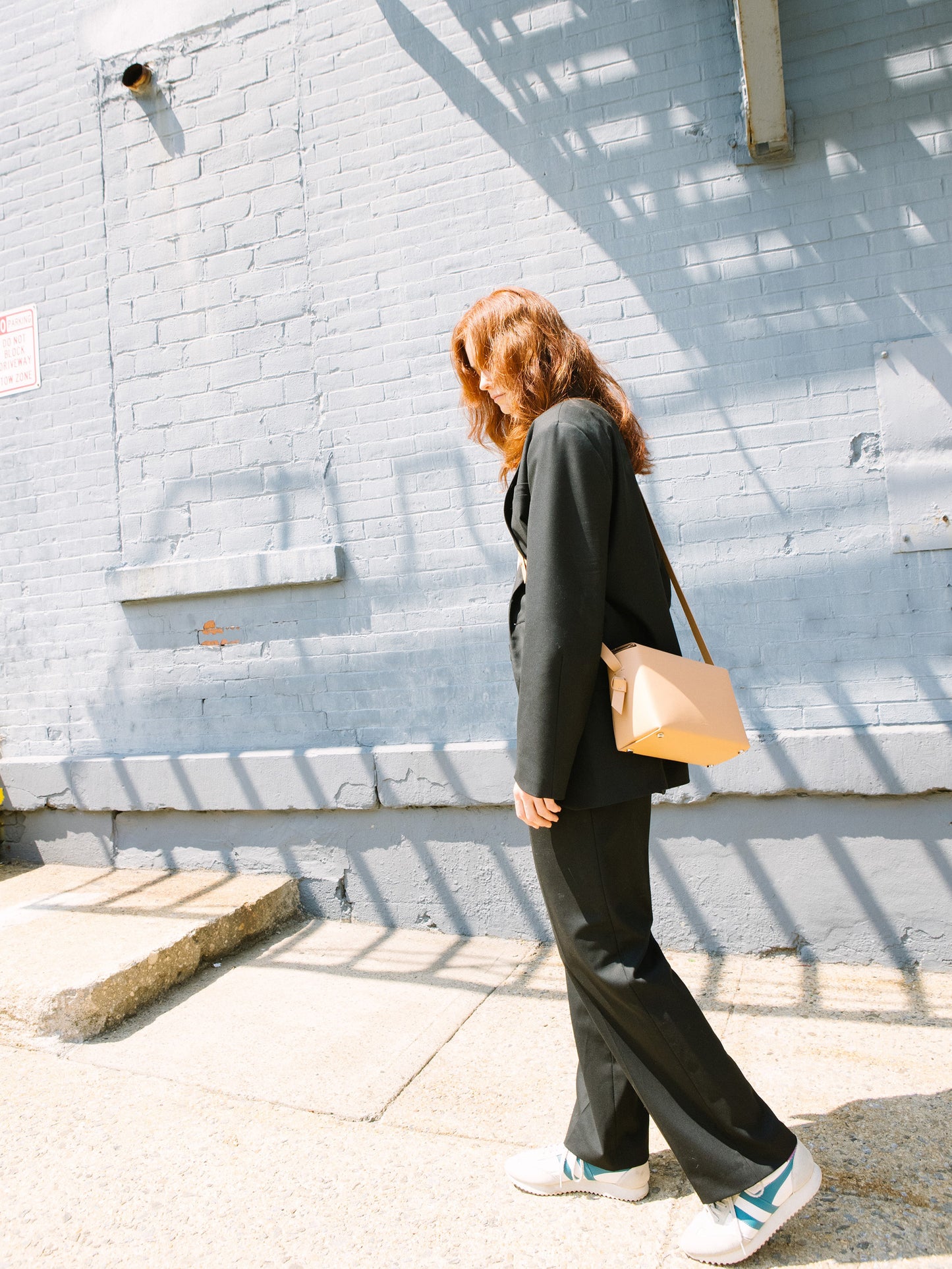 Chic beige crossbody bag and shoulder bag with adjustable strap crafted from Italian vegetable tanned leather for a minimal yet sophisticated look.