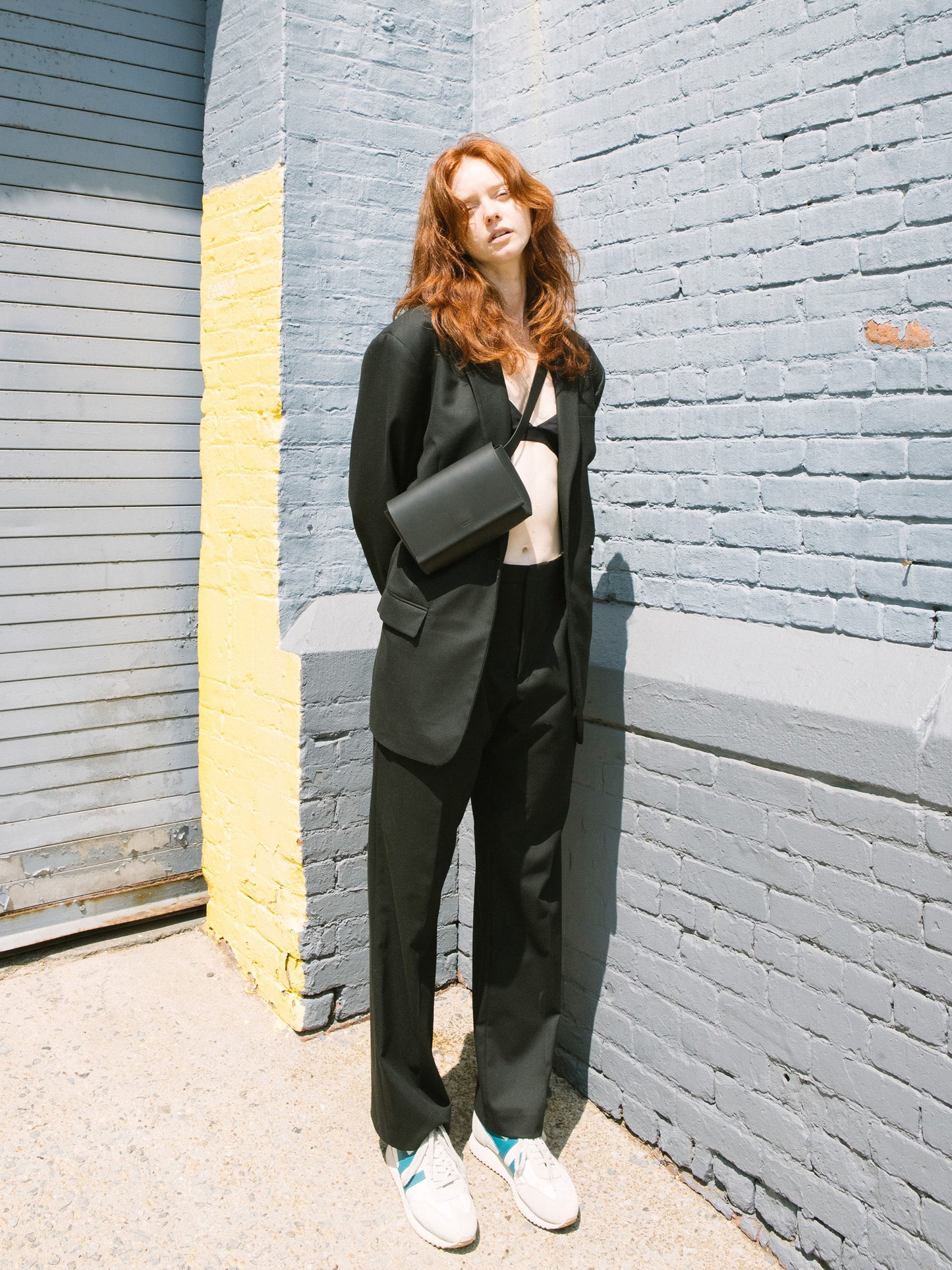 Chic black designer belt bag and fanny pack crafted from Italian vegetable tanned leather for a minimalist yet sophisticated look.