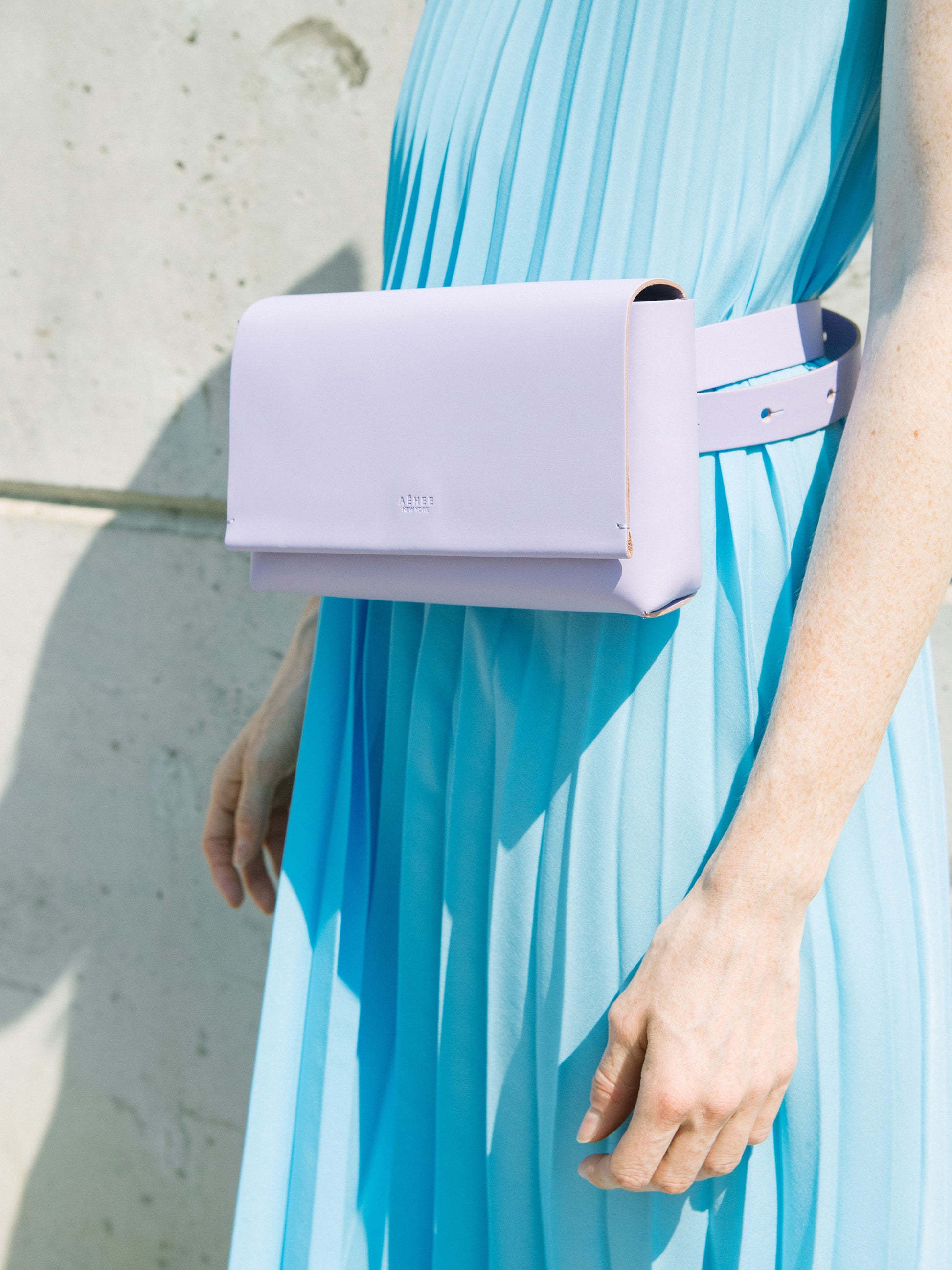 Chic lavender designer belt bag and fanny pack crafted from Italian vegetable tanned leather for a minimalist yet sophisticated look.