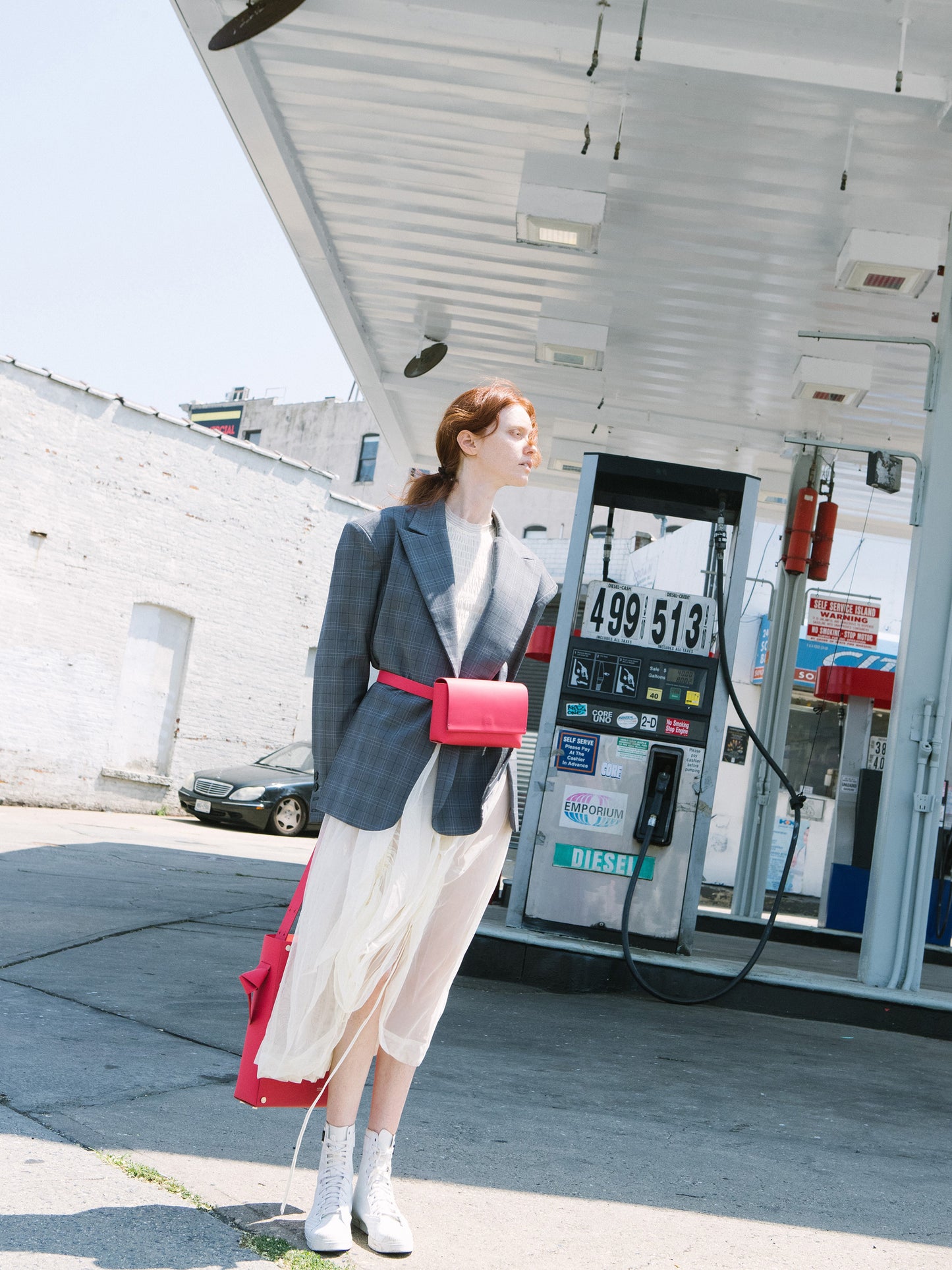 Chic red designer belt bag and fanny pack crafted from Italian vegetable tanned leather for a minimalist yet sophisticated look.