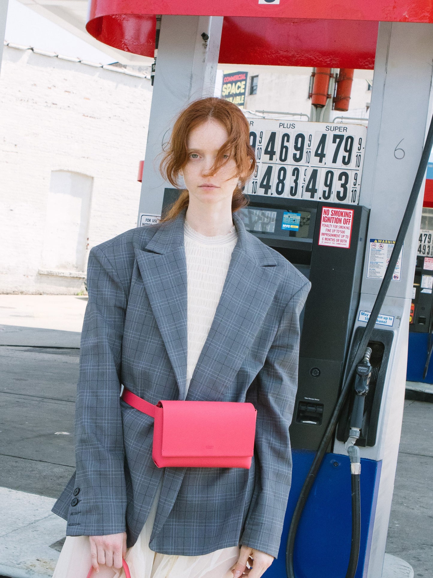 Chic red designer belt bag and fanny pack crafted from Italian vegetable tanned leather for a minimalist yet sophisticated look.