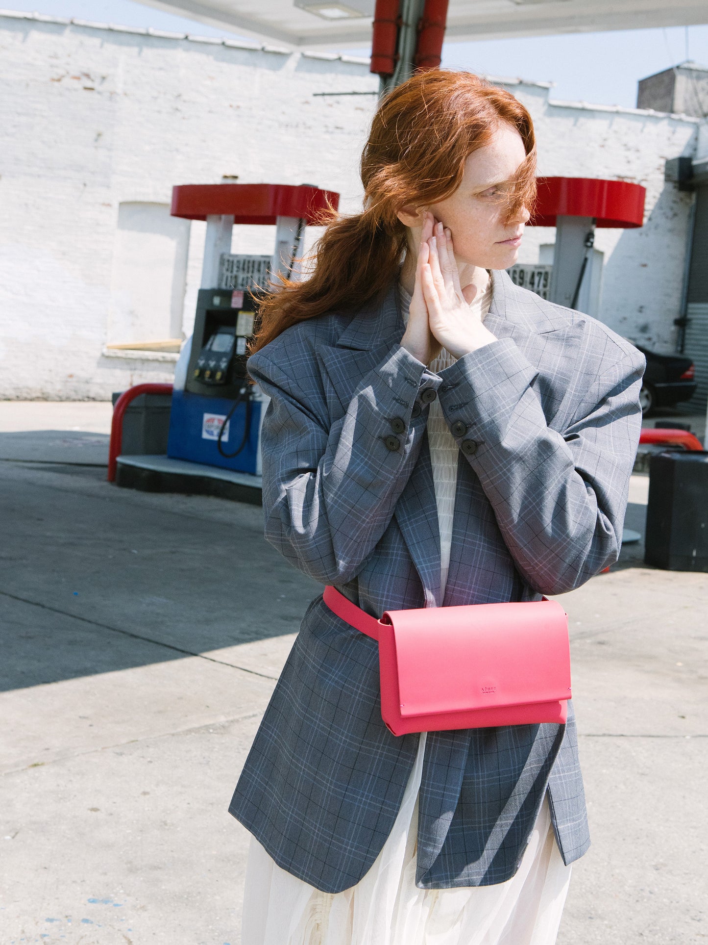 Chic red designer belt bag and fanny pack crafted from Italian vegetable tanned leather for a minimalist yet sophisticated look.