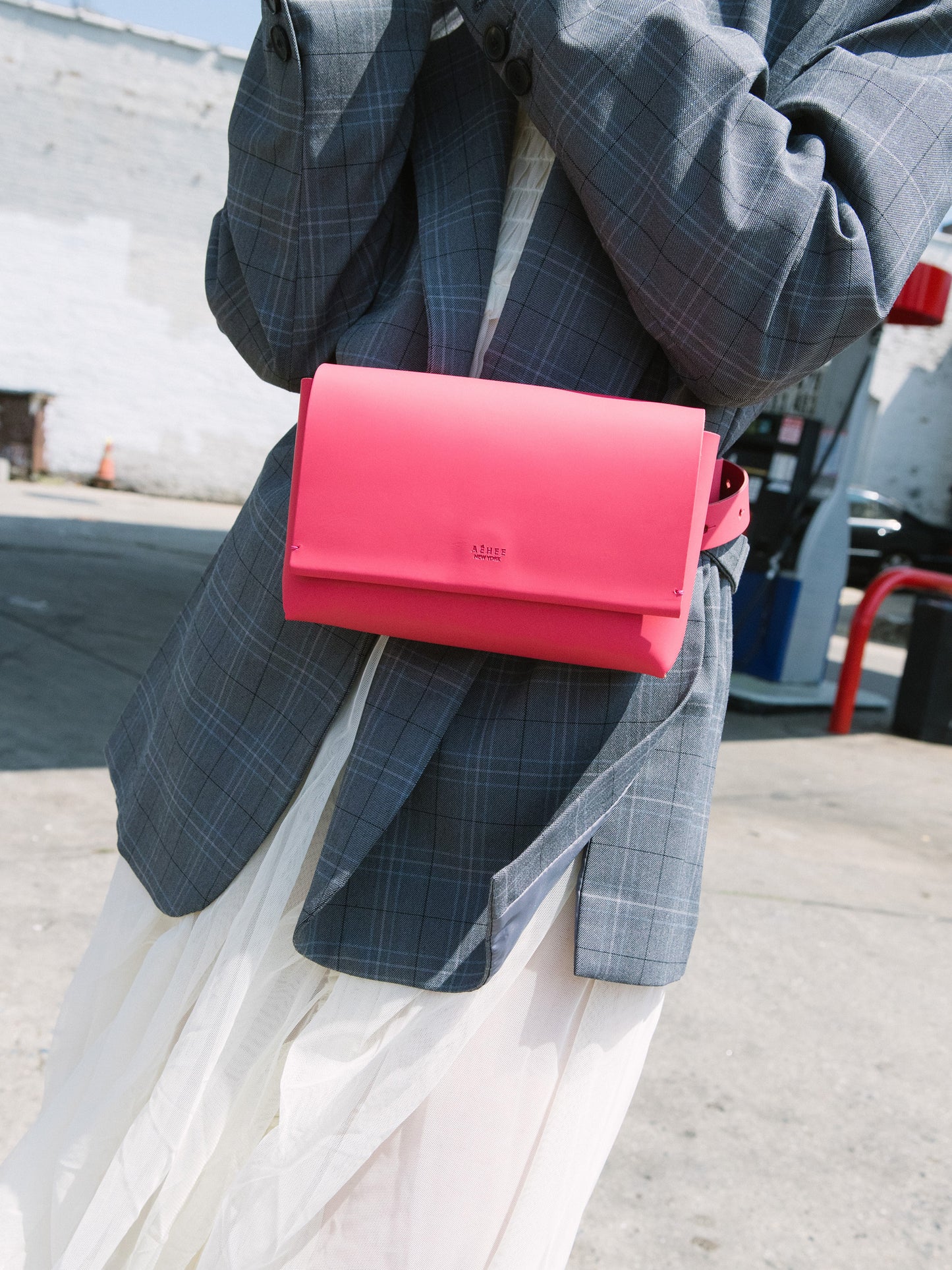 Chic red designer belt bag and fanny pack crafted from Italian vegetable tanned leather for a minimalist yet sophisticated look.