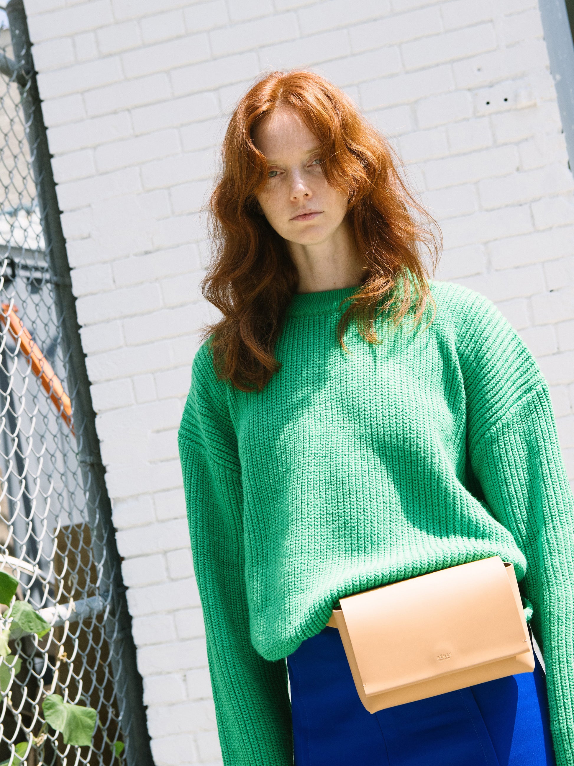 Chic beige designer belt bag and fanny pack crafted from Italian vegetable tanned leather for a minimalist yet sophisticated look.