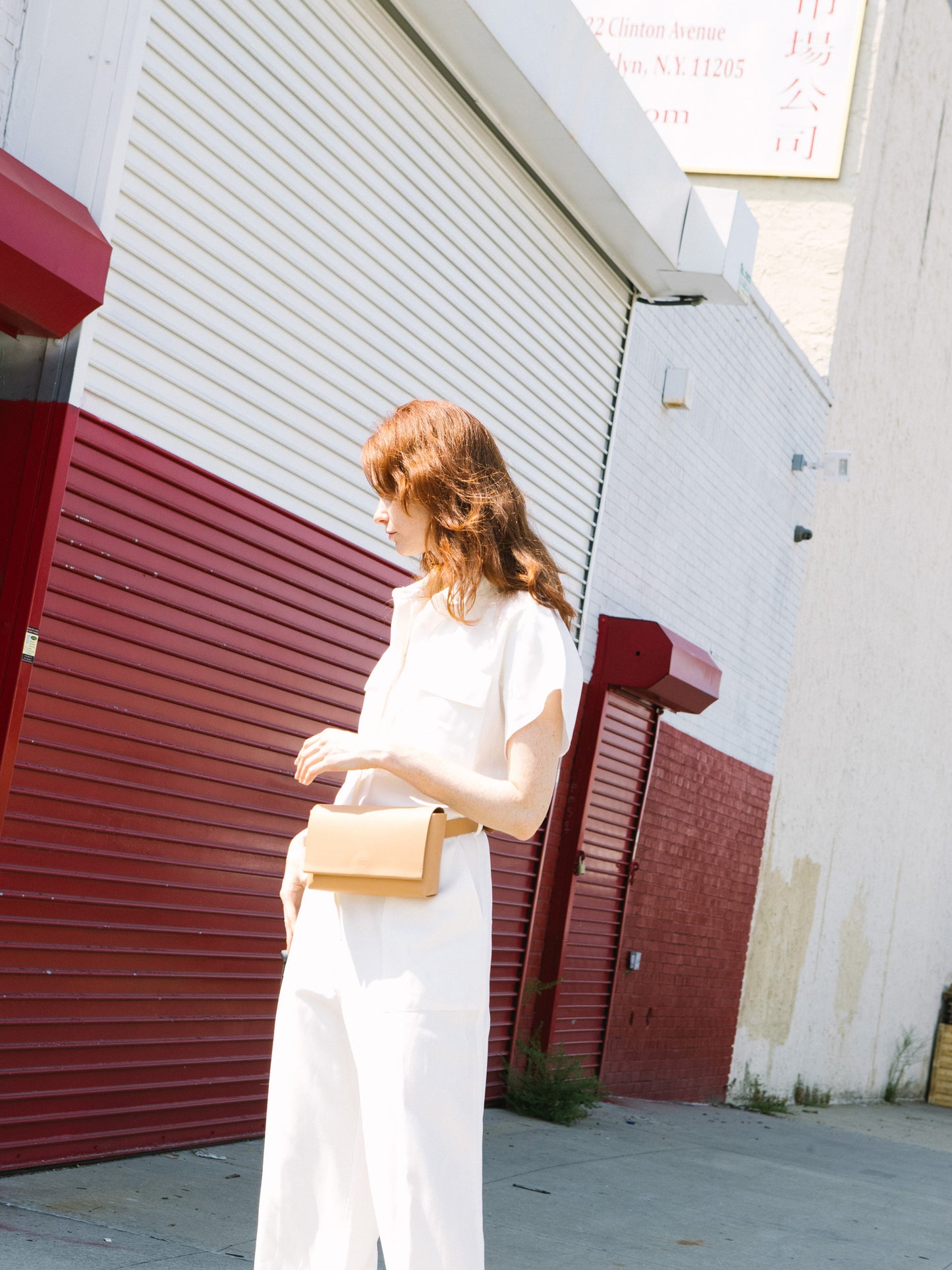 Chic beige designer belt bag and fanny pack crafted from Italian vegetable tanned leather for a minimalist yet sophisticated look.