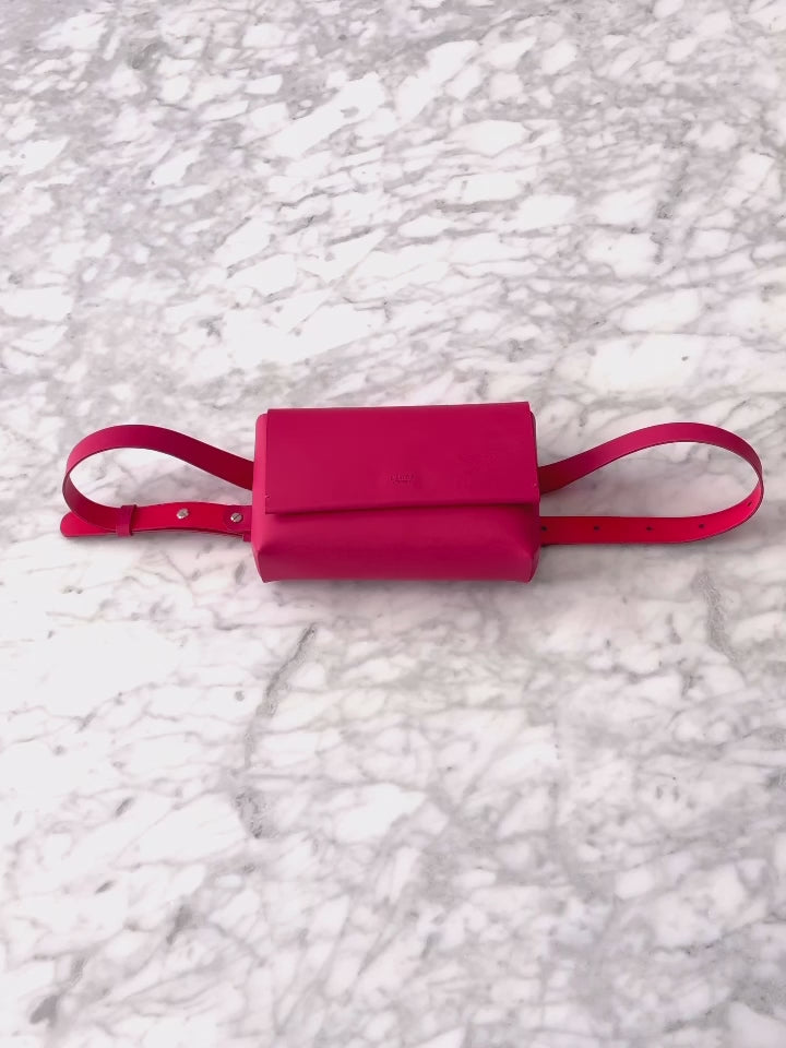 Chic designer belt bag and fanny pack crafted from Italian vegetable tanned leather for a minimalist yet sophisticated look.