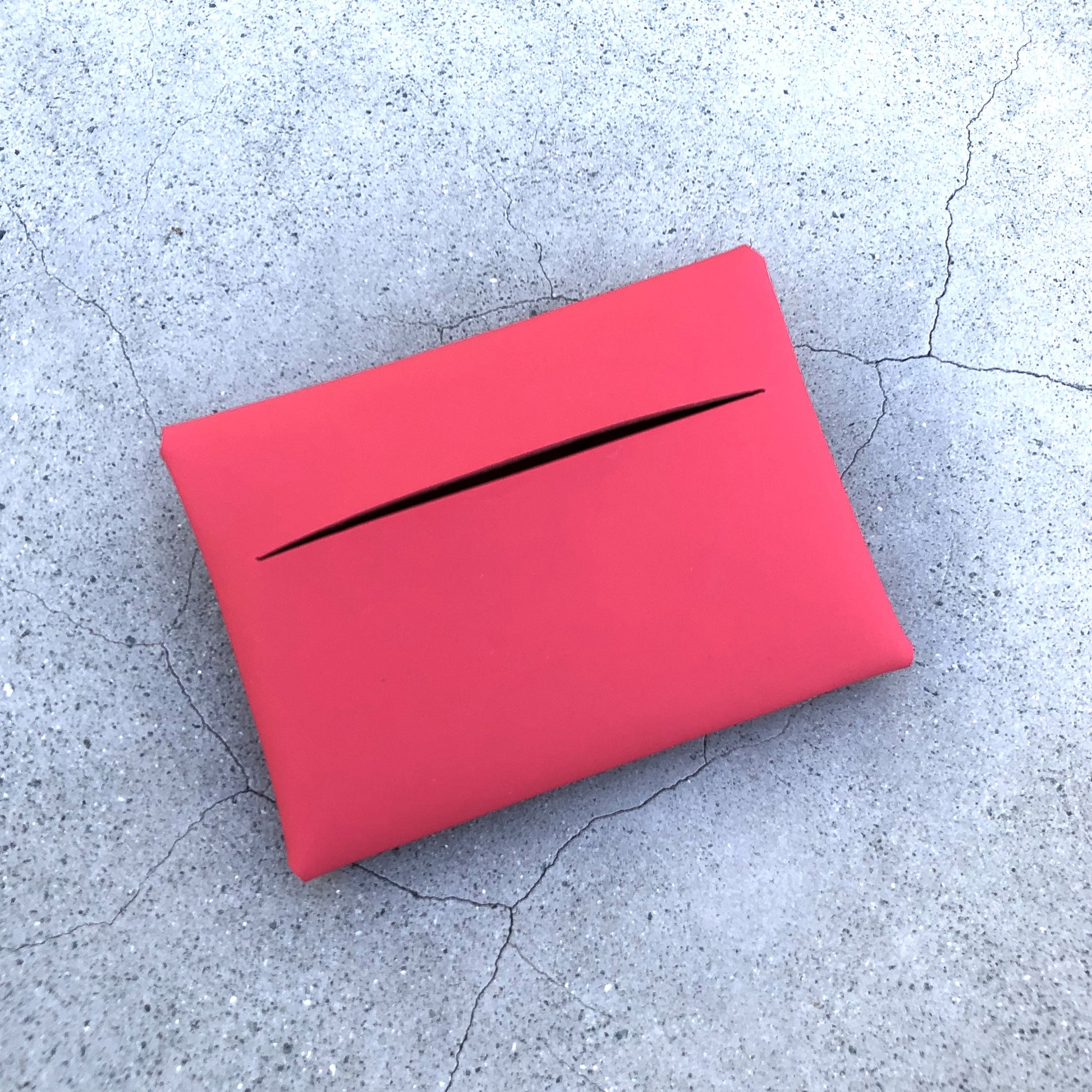 Chic red cardholder wallet crafted from Italian vegetable tanned leather for a minimal yet sophisticated look.