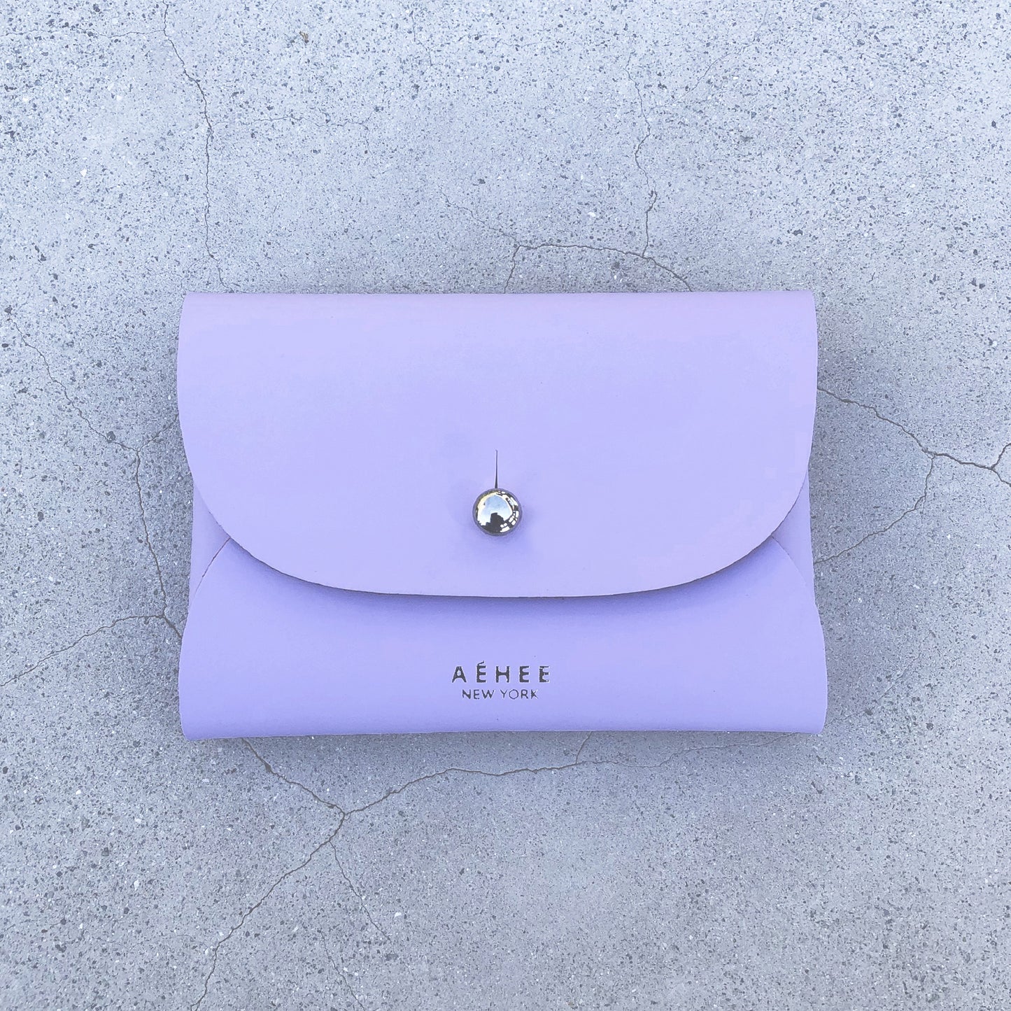 Chic lavender cardholder wallet crafted from Italian vegetable tanned leather for a minimal yet sophisticated look.