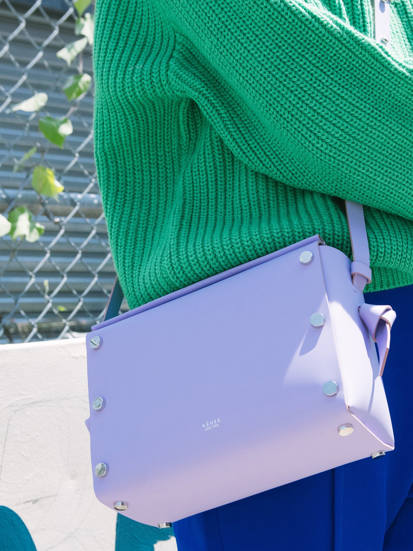 Chic lavender crossbody bag and shoulder bag with adjustable strap crafted from Italian vegetable tanned leather for a minimal yet sophisticated look.