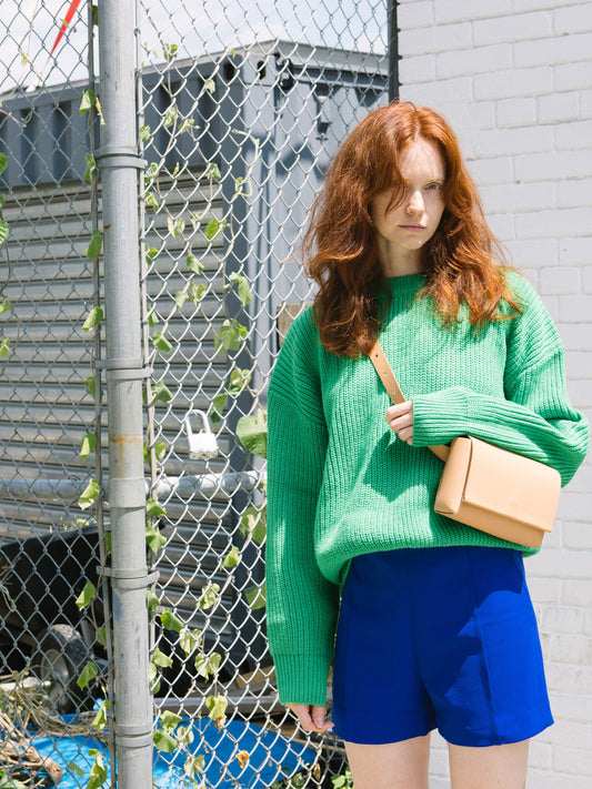 Chic beige designer belt bag and fanny pack crafted from Italian vegetable tanned leather for a minimalist yet sophisticated look.